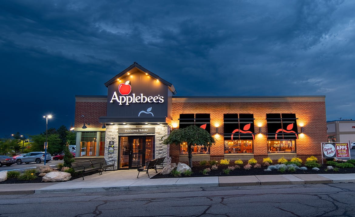 Applebee's restaurant lit up at dusk