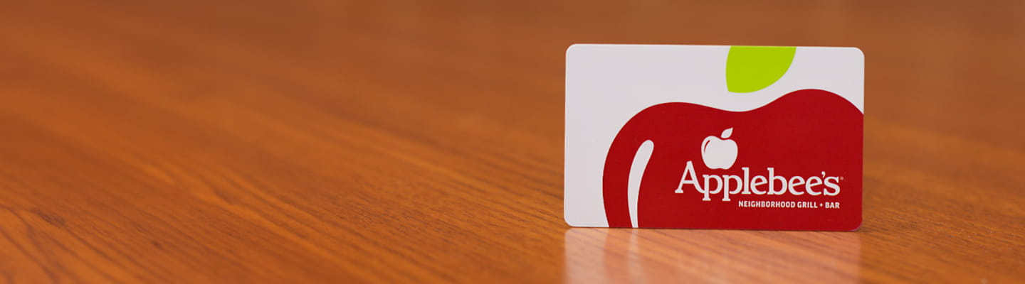 Applebee's Gift card set on top of a wooden background