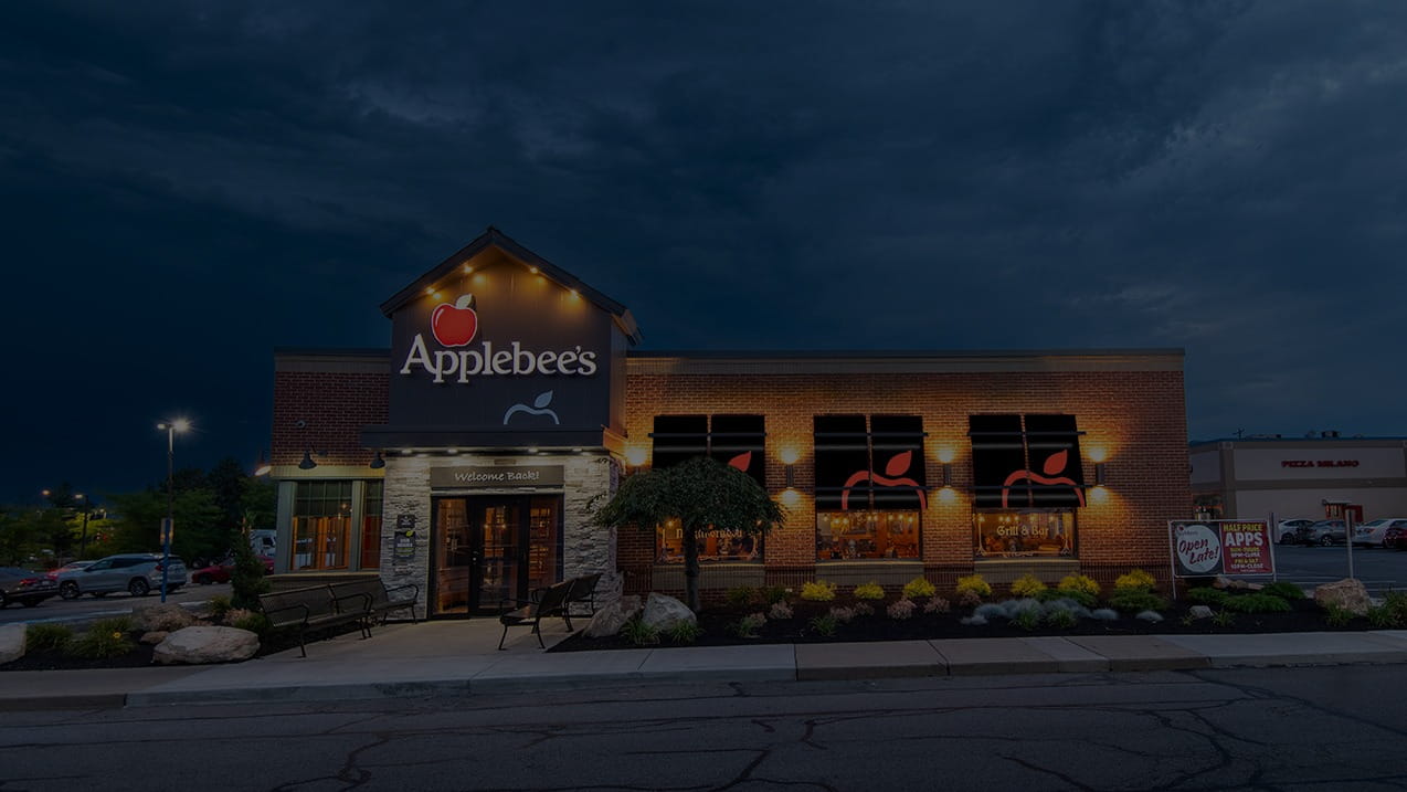 Applebee's Building facade lit up in twighlight